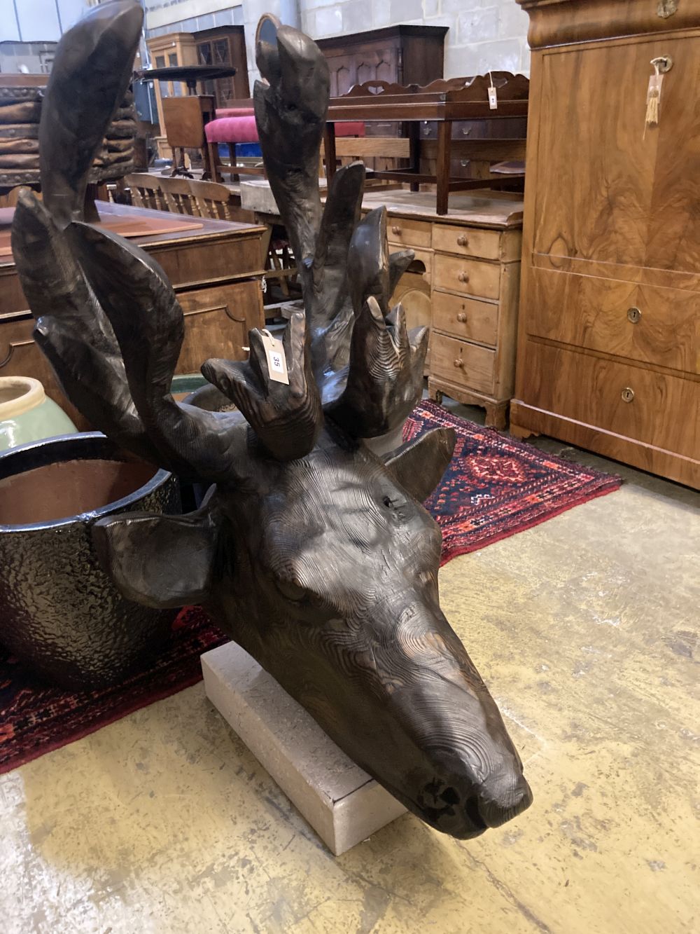 A large carved pine moose head sculpture, height 132cm